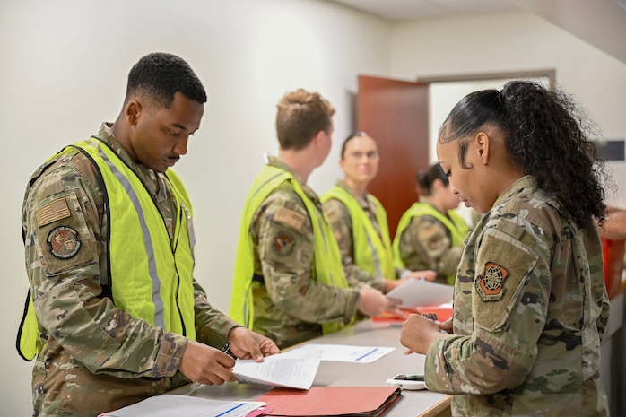 A group of Airmen out process.