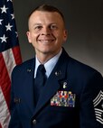 U.S. Air Force Chief Master Sgt. Steven G. Creek, 9th Reconnaissance Wing command chief, poses for his official photo.