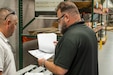 Photo of people reviewing documents