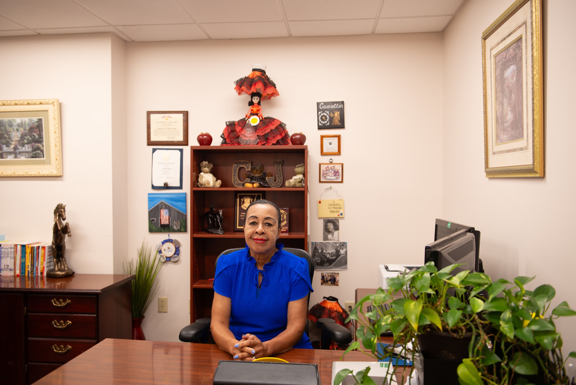 Woman sitting at desk.