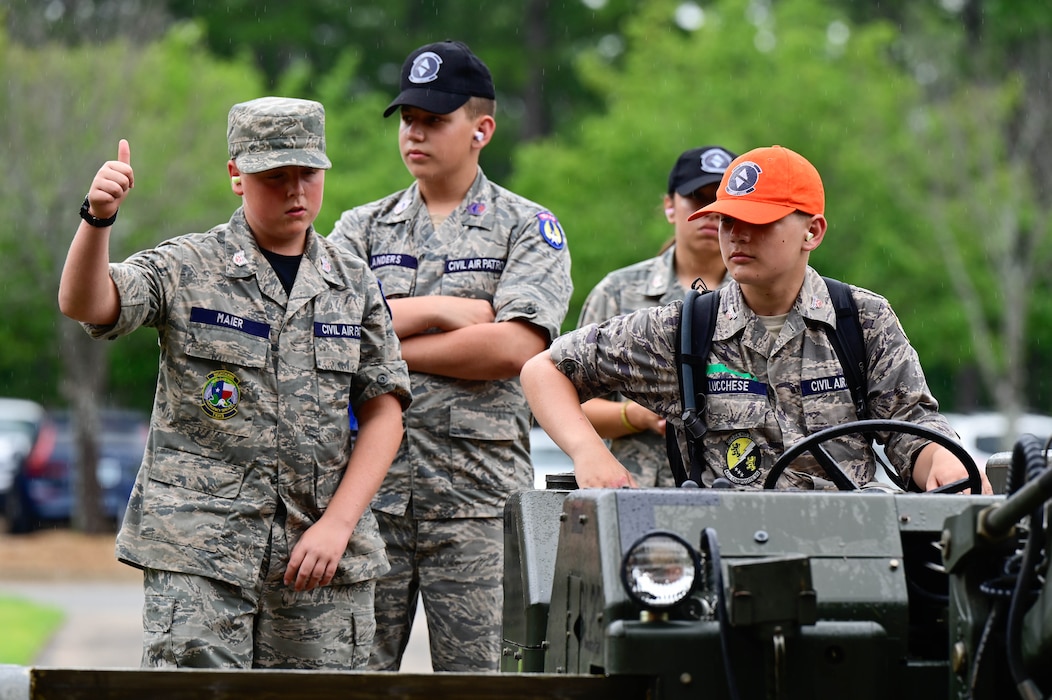 A group of boys operating equipment.