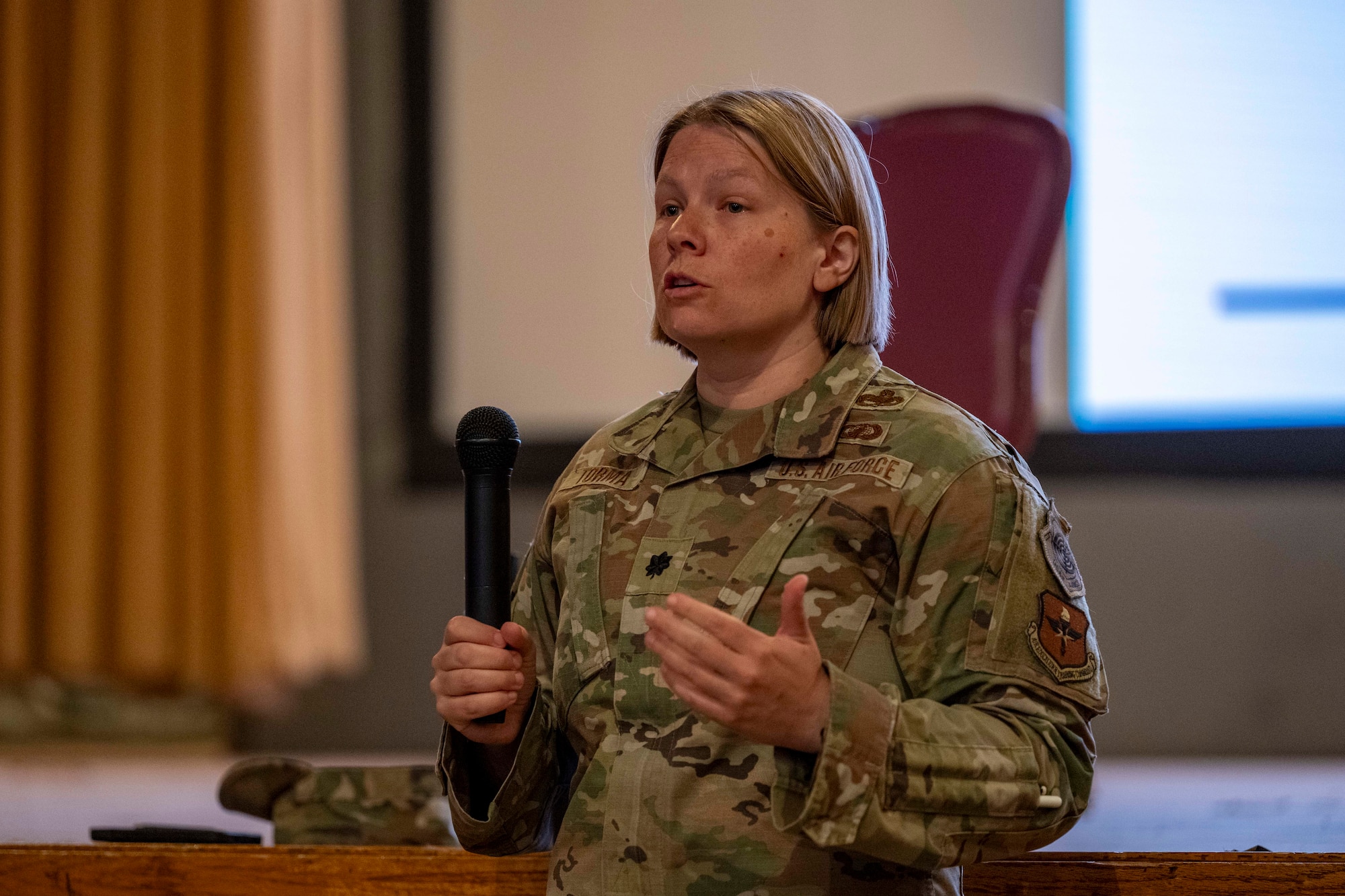 U.S. Air Force Lt. Col. Kristen Torma, 49th Maintenance Group deputy commander, speaks to Airmen during the Warfighter’s Edge Logistics Symposium at Holloman Air Force Base, New Mexico, July 9, 2025.