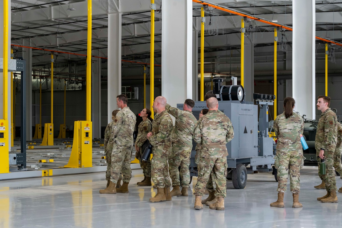 Airmen tour the 635th Materiel Maintenance Group's new storage facility during the Warfighter’s Edge Logistics Symposium at Holloman Air Force Base, New Mexico, July 8, 2025.