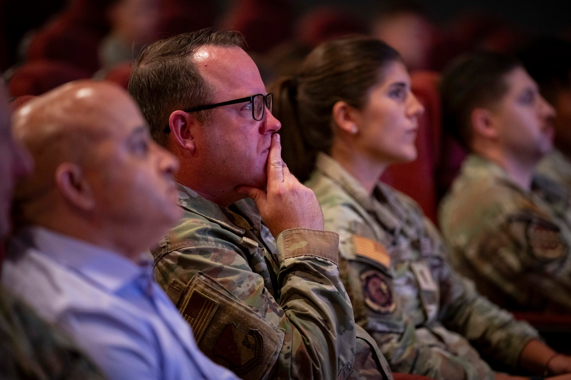 U.S. Air Force Capt. Douglas Tupper, 49th Maintenance Group chaplain, listens to a keynote speaker's presentation during the Warfighter’s Edge Logistics Symposium at Holloman Air Force Base, New Mexico, July 8, 2025.