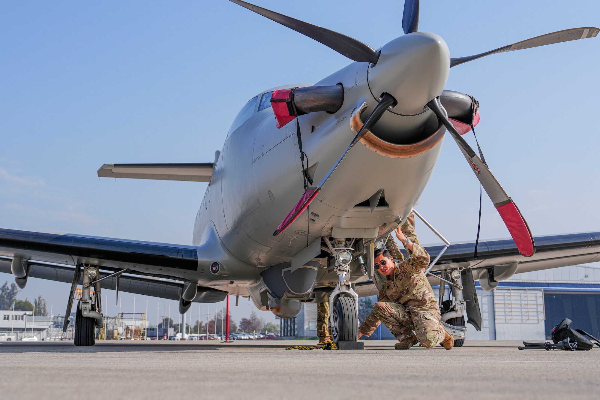 An Air Commando assigned to the 27th Special Operations Wing performs a pre-flight check on a U-28A Draco in Santiago, Chile, June 4, 2025, as part of exercise SOUTHERN STAR 25