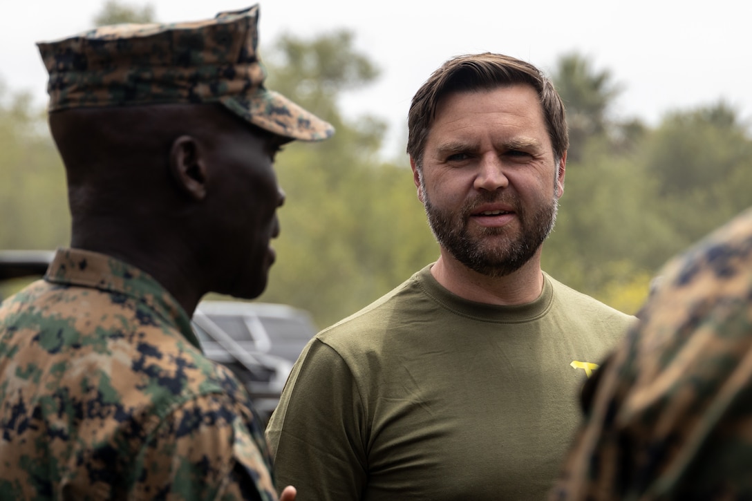 The Vice President of the United States, the Honorable JD Vance, speaks with Col. Kwabena K. Gyimah, the commanding officer of Headquarters and Support Battalion, Marine Corps Base Camp Pendleton, before a hike at MCB Camp Pendleton, California, July 11, 2025. Vance, a former Marine, led the hike to reinforce the values of camaraderie and unit cohesion. A fundamental element in Marine training, hiking builds both physical endurance and mental resilience in preparation for future battles. (U.S. Marine Corps photo by Lance Cpl. Jonathan Sherchand)