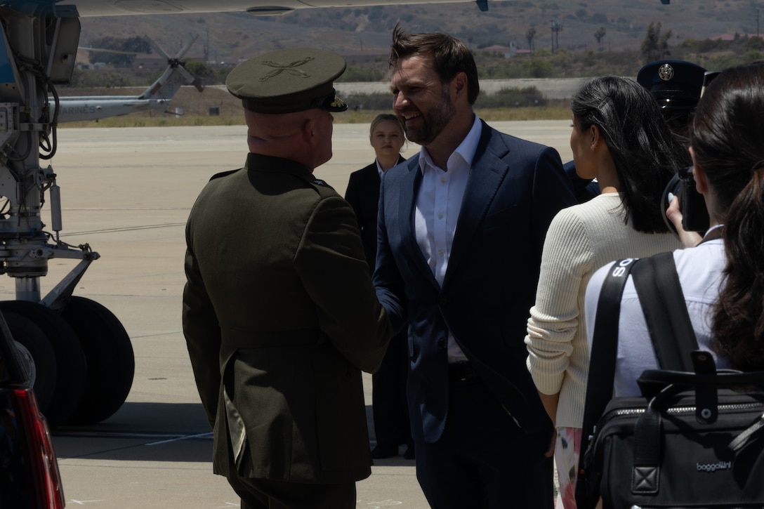 U.S. Marine Corps Brig. Gen. Michael R. Nakonieczny, the deputy commanding general of I Marine Expeditionary Force, shakes hands with the Vice President of the United States, the Honorable JD Vance, after arriving at Marine Corps Base Camp Pendleton, California, July 11, 2025. The Vances arrived at MCB Camp Pendleton to show support for military families and emphasize the importance of wellness, education, and community engagement. (U.S. Marine Corps photo by Cpl. Noah Martinez)