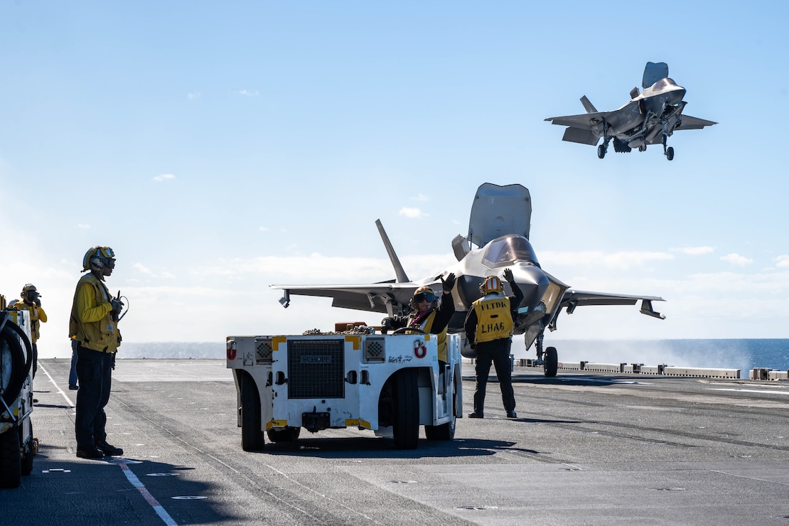 Two U.S. Marine Corps F-35B Lightning II aircraft assigned to Marine Fighter Attack Squadron (VMFA) 242, 31st Marine Expeditionary Unit, land on the flight deck of the forward-deployed amphibious assault ship USS America (LHA 6) while conducting flight operations during Exercise Talisman Sabre 25 in the Coral Sea, July 13.