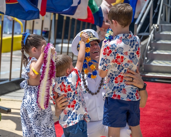 JOINT BASE PEARL HARBOR-HICKAM, Hawaii (July 12, 2025) - Cmdr. Dustin Kraemer, commanding officer of the Los Angeles-class fast-attack submarine USS Toledo (SSN 769), greets his family as Toledo arrives at Joint Base Pearl Harbor-Hickam during its change of homeport, July 12, 2025. Toledo is assigned to Submarine Squadron 7 and is capable of supporting various missions, including anti-submarine warfare, anti-surface ship warfare, strike warfare, and intelligence, surveillance, and reconnaissance. (U.S. Navy photo by Mass Communication Specialist 1st Class Scott Barnes)