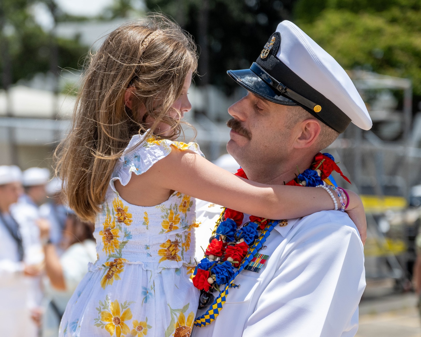 JOINT BASE PEARL HARBOR-HICKAM, Hawaii (July 12, 2025) - A Sailor assigned to the Los Angeles-class fast-attack submarine USS Toledo (SSN 769) greets his family as Toledo arrives at Joint Base Pearl Harbor-Hickam during its change of homeport, July 12, 2025. Toledo is assigned to Submarine Squadron 7 and is capable of supporting various missions, including anti-submarine warfare, anti-surface ship warfare, strike warfare, and intelligence, surveillance, and reconnaissance. (U.S. Navy photo by Mass Communication Specialist 1st Class Scott Barnes)