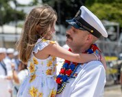 JOINT BASE PEARL HARBOR-HICKAM, Hawaii (July 12, 2025) - A Sailor assigned to the Los Angeles-class fast-attack submarine USS Toledo (SSN 769) greets his family as Toledo arrives at Joint Base Pearl Harbor-Hickam during its change of homeport, July 12, 2025. Toledo is assigned to Submarine Squadron 7 and is capable of supporting various missions, including anti-submarine warfare, anti-surface ship warfare, strike warfare, and intelligence, surveillance, and reconnaissance. (U.S. Navy photo by Mass Communication Specialist 1st Class Scott Barnes)
