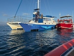Coast Guard assist catamaran