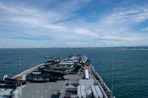 BRISBANE, Australia (July 9, 2025) The forward-deployed amphibious assault ship USS America (LHA 6) pulls into Brisbane, Australia, for a scheduled port visit July 9. The America, lead ship of the America Amphibious Ready Group, is operating in the U.S. 7th Fleet area of operations. U.S. 7th Fleet is the U.S. Navy’s largest forward-deployed numbered fleet, and routinely interacts and operates with allies and partners in preserving a free and open Indo-Pacific region. (U.S. Navy photo by Mass Communication Specialist Seaman Nicholas Douglass)