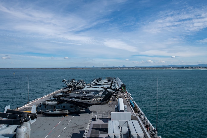 BRISBANE, Australia (July 9, 2025) The forward-deployed amphibious assault ship USS America (LHA 6) pulls into Brisbane, Australia, for a scheduled port visit July 9. The America, lead ship of the America Amphibious Ready Group, is operating in the U.S. 7th Fleet area of operations. U.S. 7th Fleet is the U.S. Navy’s largest forward-deployed numbered fleet, and routinely interacts and operates with allies and partners in preserving a free and open Indo-Pacific region. (U.S. Navy photo by Mass Communication Specialist Seaman Nicholas Douglass)