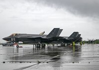 F-35s parked on flightline.