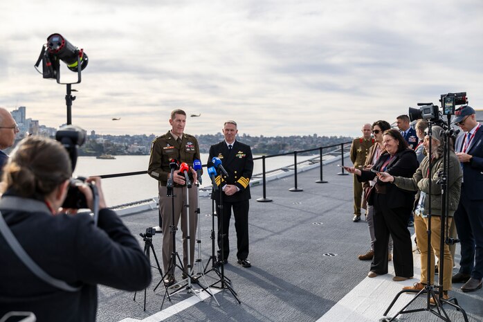 Lieutenant General Joel Vowell, Deputy Commanding General for U.S. Army Pacific (USARPAC) and Australian Defence Force Chief of Joint Operations, Vice Admiral Justin Jones, AO, CSC, RAN address the media at the opening ceremony for Exercise Talisman Sabre 25 onboard HMAS Adelaide in Sydney, New South Wales.