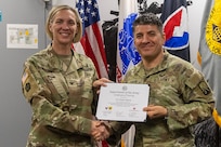Col. Michelle M. Williams, U.S. Army Financial Management Command commander, presents 1st Lt. Shkar Hakim, 106th Finance Battalion operations officer, with a certificate of completion for graduating the U.S. Army Operational Banking Short Course at the Maj. Gen. Emmett J. Bean Federal Center in Indianapolis June 6, 2025. USAFMCOM created the course to prepare more finance and comptroller officers and senior noncommissioned officers to serve as banking officers around the globe. (U.S. Army photo by Brad Staggs)