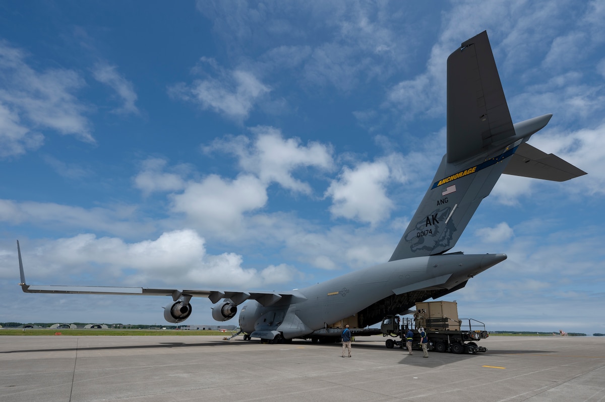 A C-17 Globemaster III assigned to the 176th Wing, Alaska Air National Guard, offloads cargo in support of exercise Resolute Force Pacific (REFORPAC) 2025 at Misawa Air Base, Japan, July 11, 2025. Mobility aircraft provide critical airlift, air refueling, aeromedical evacuation and command and control to project, connect, maneuver and sustain the Joint Force during the Department-Level Exercise Department of the Air Force series, including REFORPAC. (U.S. Air Force photo by Senior Airman Brittany Russell)