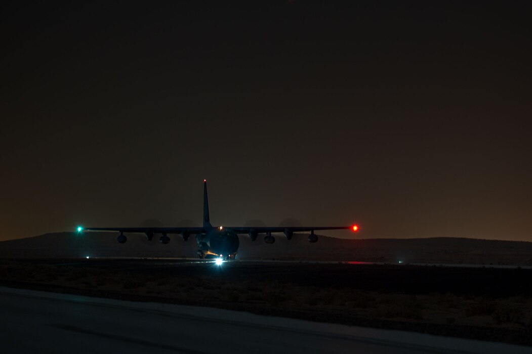 A U.S. Air Force HC-130J Combat King II assigned to the 26th Expeditionary Rescue Squadron unloads cargo.