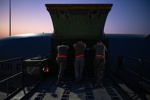 U.S. Airmen assigned to the 379th Expeditionary Air Base Group load cargo onto a KC-135 Stratotanker within the U.S. Central Command area of responsibility, June 12, 2025. In addition to its refueling mission, the KC-135’s unique assets enable it to support a wide range of operations including transporting passengers, cargo and ambulatory patients during aeromedical evacuations. (U.S. Air Force photo by Senior Airman Amanda Jett)