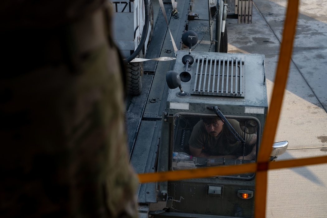A U.S. Airman, forward deployed to the 379th Air Expeditionary Wing, operates a K-loader within the U.S. Central Command area of responsibility, June 12, 2025. As one of Ninth Air Force (Air Forces Central)’s expeditionary Wings, the 379th AEW supports a wide range of missions to include humanitarian airlift activities, mission-essential combat power, aeromedical evacuation and intelligence support for multiple-theater operations. (U.S. Air Force photo by Senior Airman Amanda Jett)