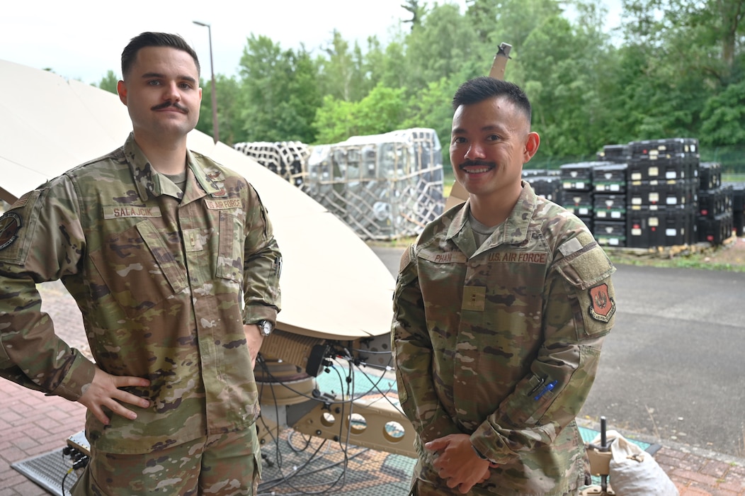 Warrant Officer Franko Salajcik, technical integrator, 1st Combat Communications Squadron (Left), and Chief Warrant Officer 2 Louis Phan, technical integrator, 435th Communications Operations Group (Right), pose for a photo at Ramstein Air Base, Germany, July 11, 2025. They are among the first Warrant Officers in in U.S. Air Forces in Europe, where they will leverage their expertise to enhance operational effectiveness. (U.S. Air Force photo by Capt. Lou Burton)