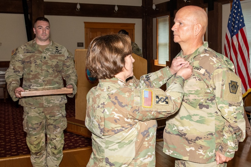 Command Sgt. Maj. Andrew Campbell, who most recently served as the Pennsylvania Army National Guard command sergeant major, is honored during a retirement ceremony conducted June 12 at Fort Indiantown Gap’s Keystone Conference Center. Campbell, who retired after 33 years of service, enlisted into the active-duty Army in 1992. He began his position as the Pennsylvania Army National Guard command sergeant major July 1, 2021, in which he was the principal advisor to the deputy adjutant general-Army and staff on matters pertaining to the enlisted Soldiers of the Pennsylvania Army National Guard. (Pennsylvania National Guard photo by Wayne V. Hall)