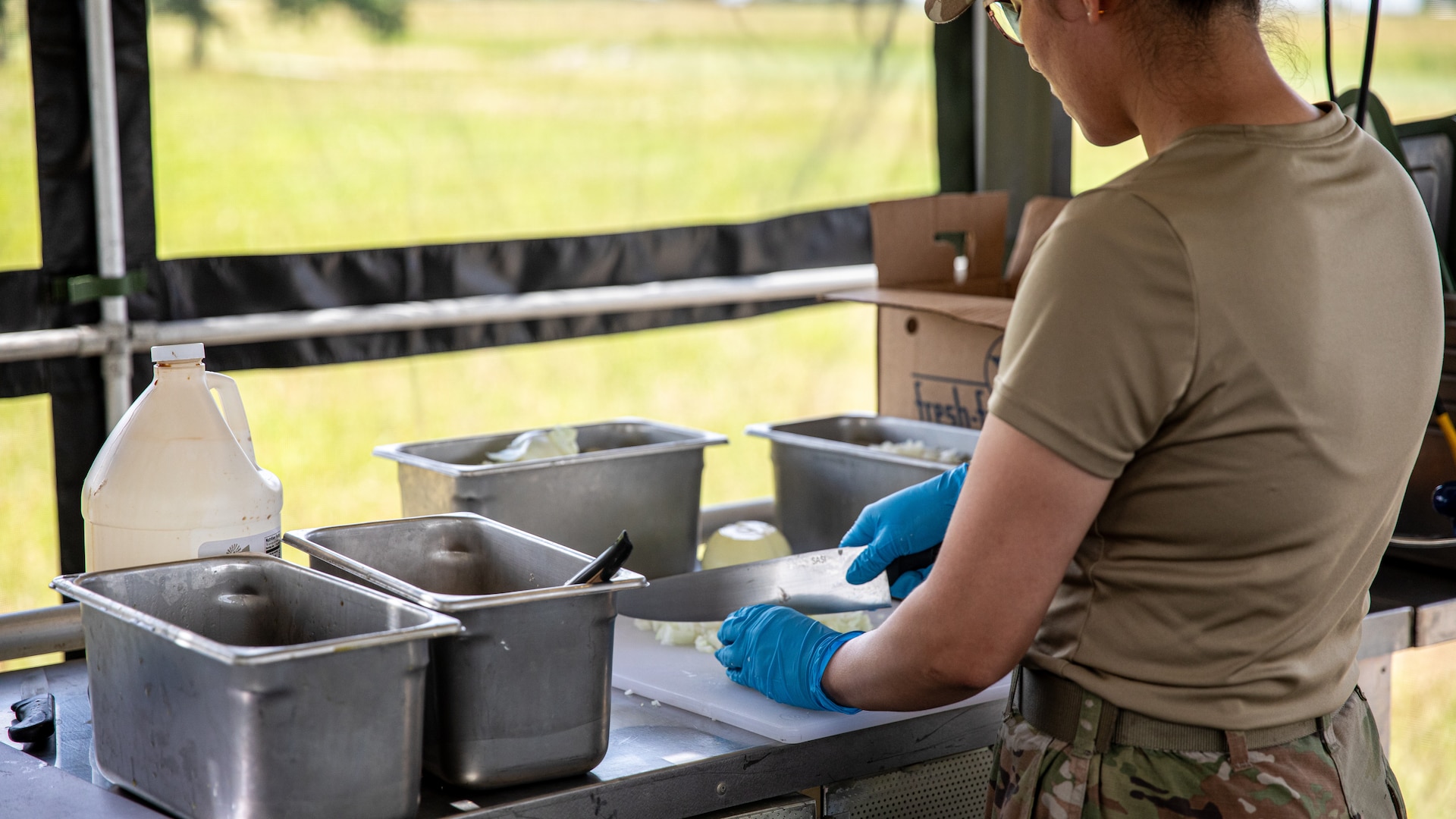 An Oklahoma Army National Guard Soldier assigned to the 903rd Quartermaster Company, 345th Combat Sustainment Support Battalion, 90th Troop Command prepares food during the second annual Oklahoma Army National Guard Culinary Excellence Competition at Camp Gruber Training Center, Oklahoma, June 7, 2025. Four teams from 90th Troop Command and the 45th Infantry Brigade Combat Team competed in the competition with a team from the 903rd winning for the second year consecutively. (Oklahoma National Guard photo by Spc. Brooklyn Clark)