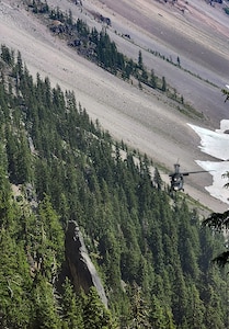 An Oregon Army National Guard HH-60M Black Hawk helicopter, assigned to the 641st Aviation Regiment, conducts a search and rescue mission on July 13, 2025