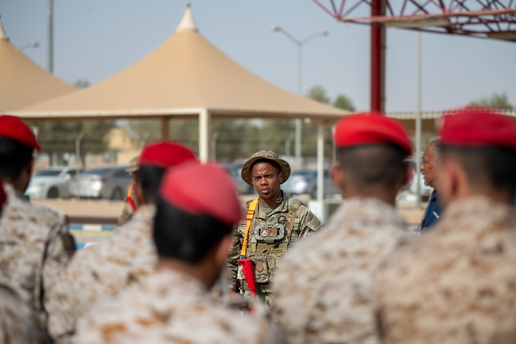 a USAF Airmen gives a speech to RSAF service members