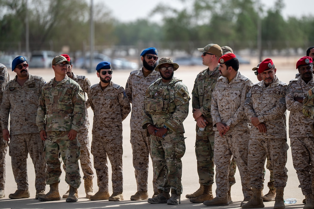 USAF and RSAF service members watch an exercise demonstration