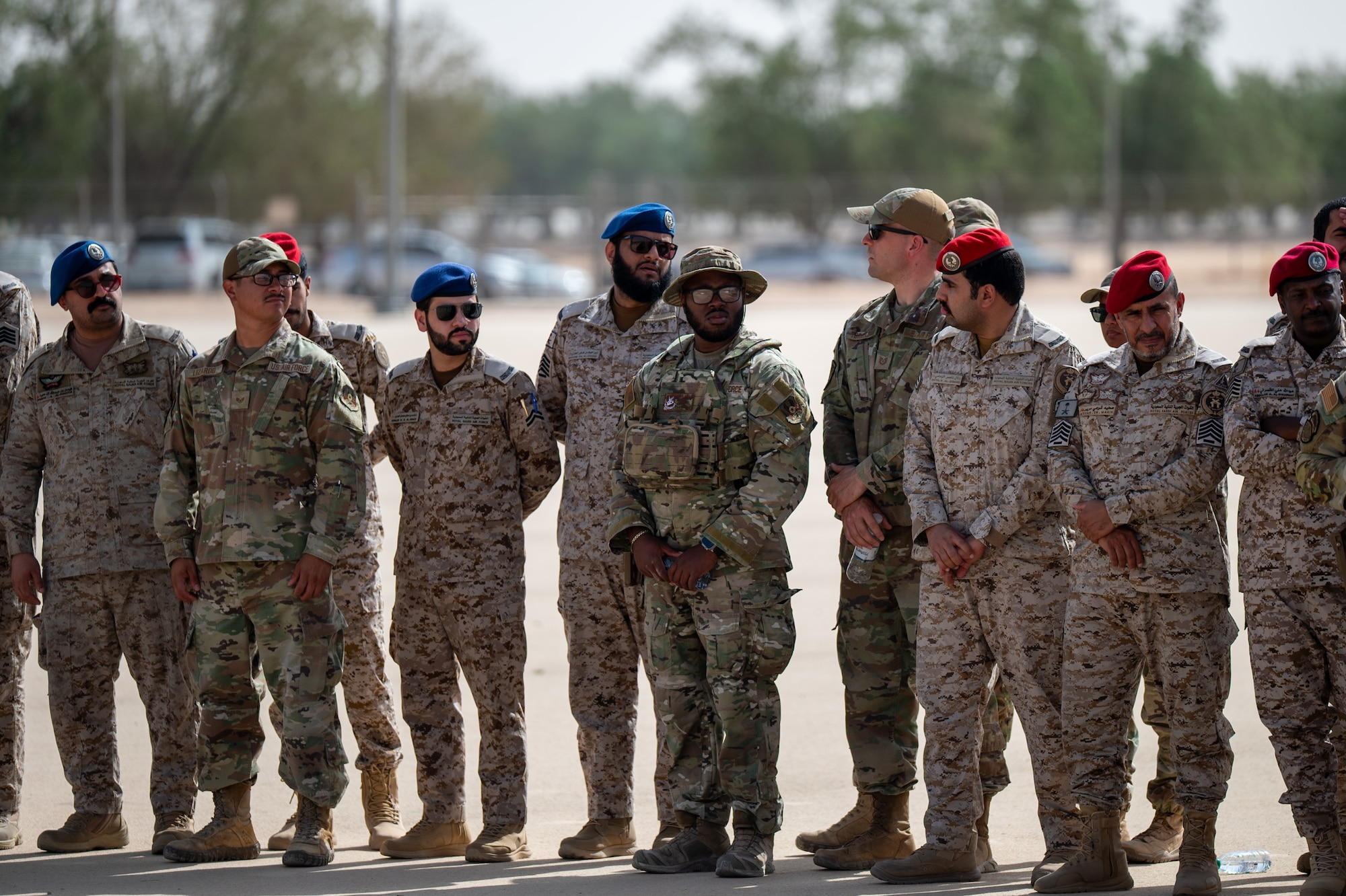 USAF and RSAF service members watch an exercise demonstration