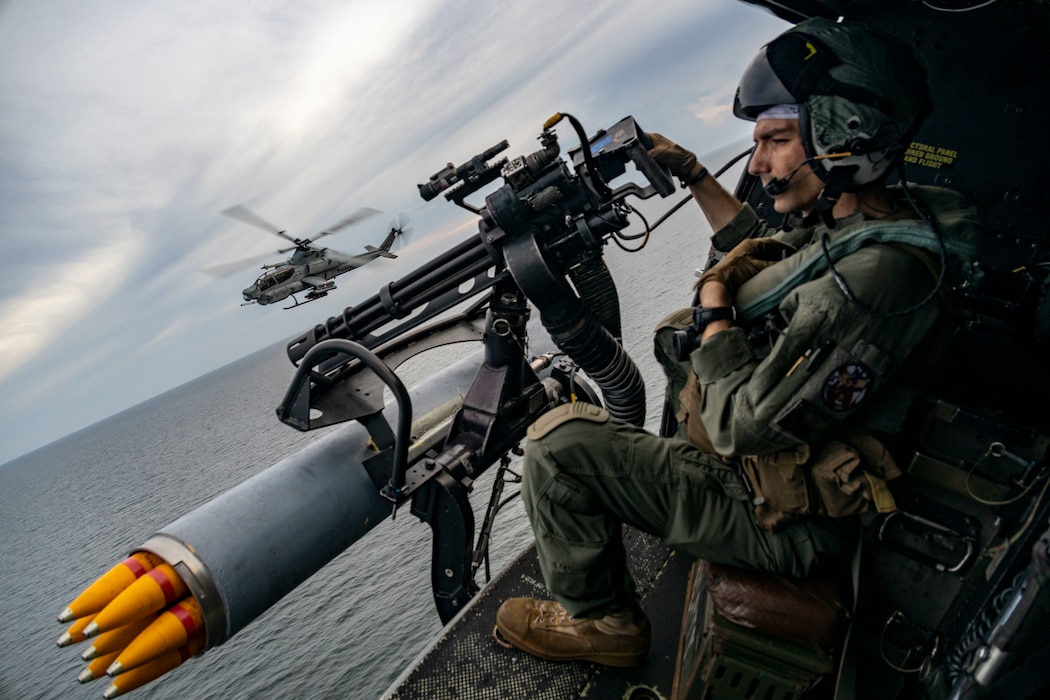 U.S. Marine Corps Sgt. Raylin Carter, an aerial observer from Oklahoma with Marine Medium Tiltrotor Squadron (VMM) 362 (Reinforced), 13th Marine Expeditionary Unit, participates in flight operations with AH-1Z Viper pilots during a strait transit, Jan. 9, 2023.