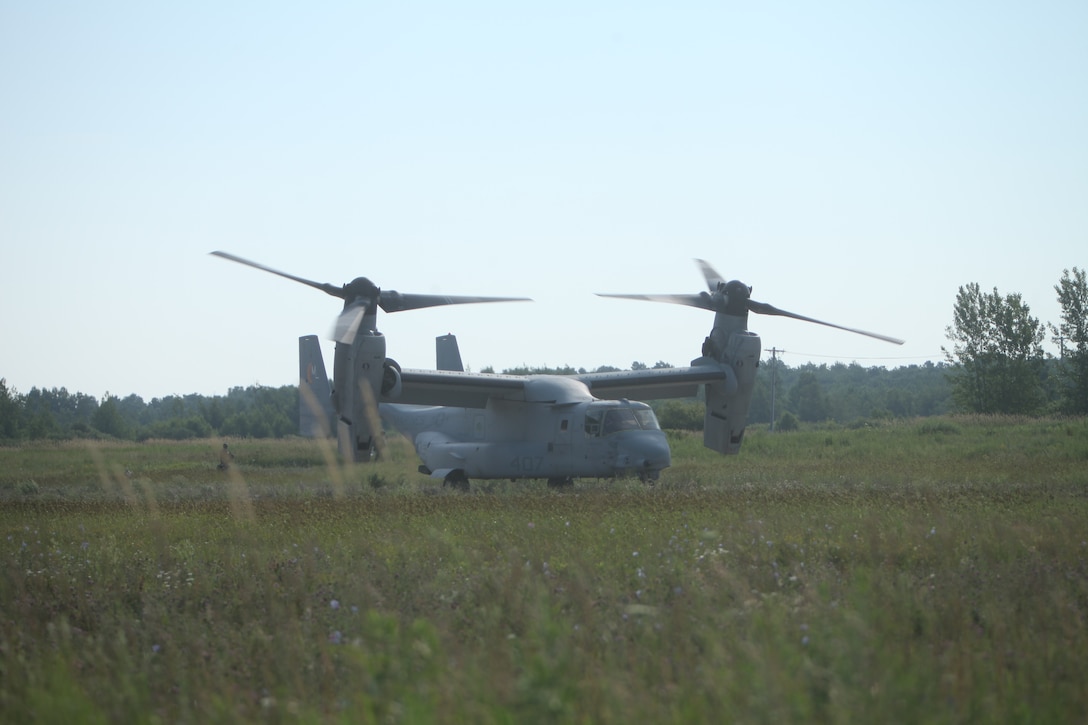 U.S. Marines disembark and offload equipment from an MV-22 Osprey ‘jump’ combat operations center event during Atlantic Alliance 25 (AA25)