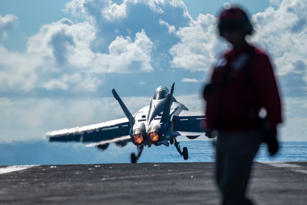 An F/A-18F Super Hornet from the "Fighting Redcocks" of Strike Fighter Squadron (VFA) 22 launches from the flight deck of the aircraft carrier USS Nimitz (CVN 68) in the Philippine Sea, April 22, 2025.