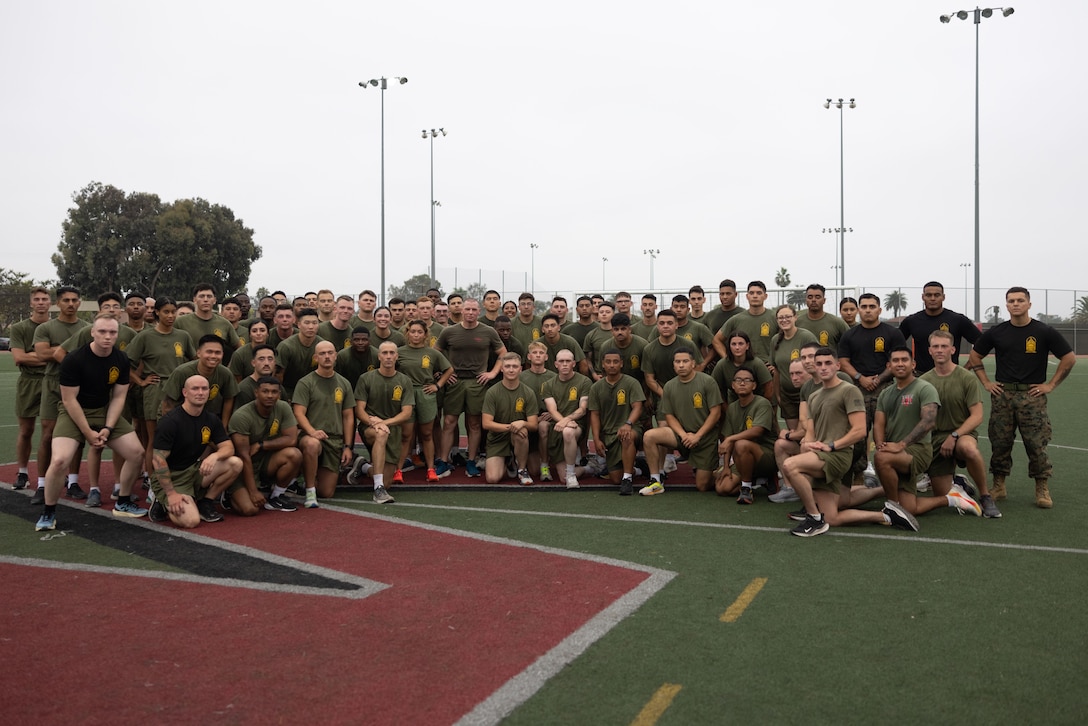 U.S. Marines with 3rd Marine Aircraft Wing pose for a photograph following 3rd MAW Corporals Course physical fitness training alongside 3rd MAW senior leaders at Marine Corps Air Station Miramar, California, July 11, 2025.