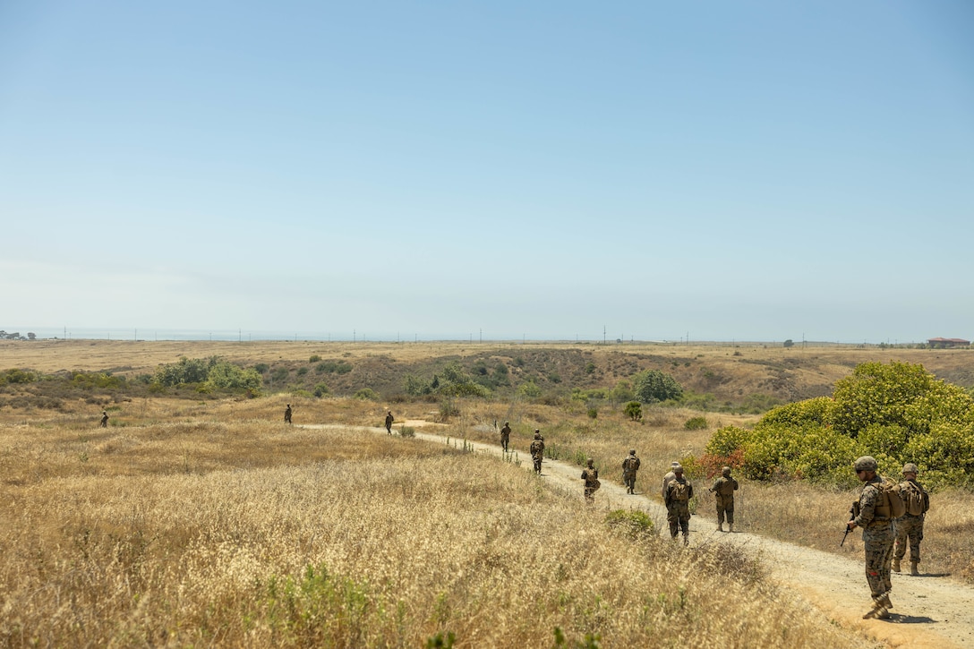 U.S. Marines with 1st Distribution Support Battalion, Combat Logistics Regiment 1, 1st Marine Logistics Group, practice patrol techniques during Riptide Fury on Marine Corps Base Camp Pendleton, California, July 10, 2025.