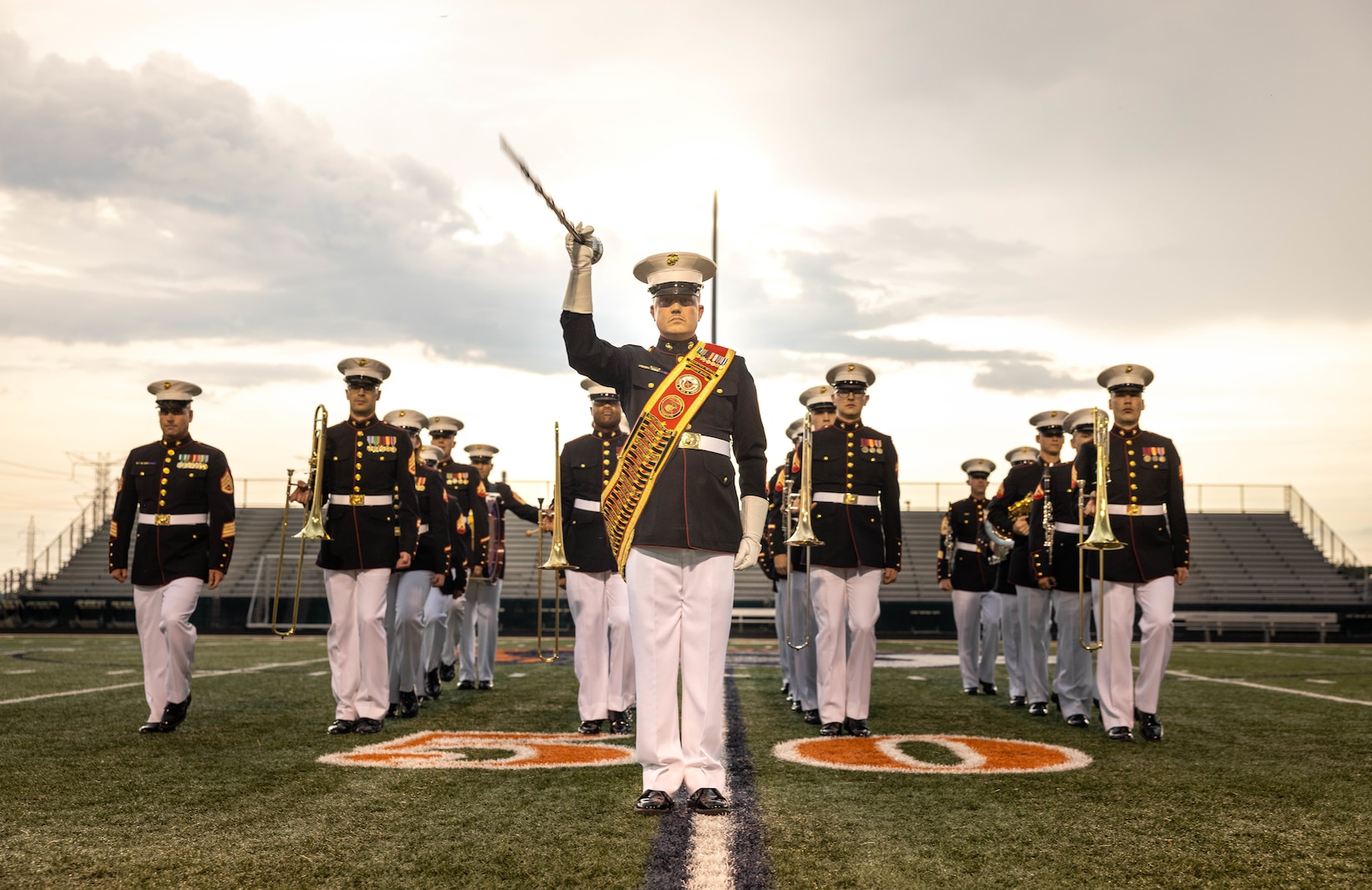 The Quantico Marine Band performs during Marine Week at Romeoville High School, Romeoville, Illinois, July 10, 2025. Marine Week Chicago celebrated 250 years of the Marine Corps at Romeoville High School with static displays, a silent drill performance, music, games, and flight simulators. (U.S. Marine Corps photo by Lance Cpl. Harleigh Faulk)