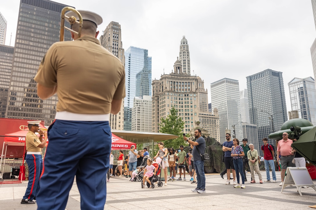 The Quantico Brass Band performs for Chicago Marine Week at Pioneer Court, Chicago, Illinois, July 11, 2025. Marines from around the Corps and the people of Chicago attended Marine Week Chicago to celebrate the Marine Corps’ 250th anniversary, which consisted of live performances, music, ceremonies, events, and displays of equipment, and aircraft. (U.S. Marine Corps photo by Lance Cpl. Harleigh Faulk)
