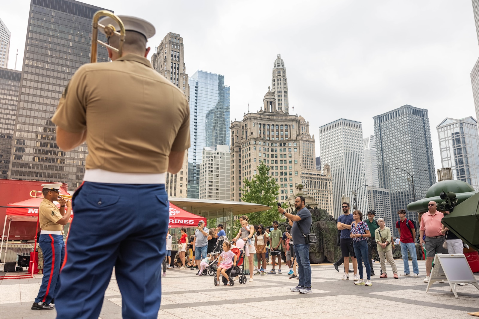 The Quantico Brass Band performs for Chicago Marine Week at Pioneer Court, Chicago, Illinois, July 11, 2025. Marines from around the Corps and the people of Chicago attended Marine Week Chicago to celebrate the Marine Corps’ 250th anniversary, which consisted of live performances, music, ceremonies, events, and displays of equipment, and aircraft. (U.S. Marine Corps photo by Lance Cpl. Harleigh Faulk)