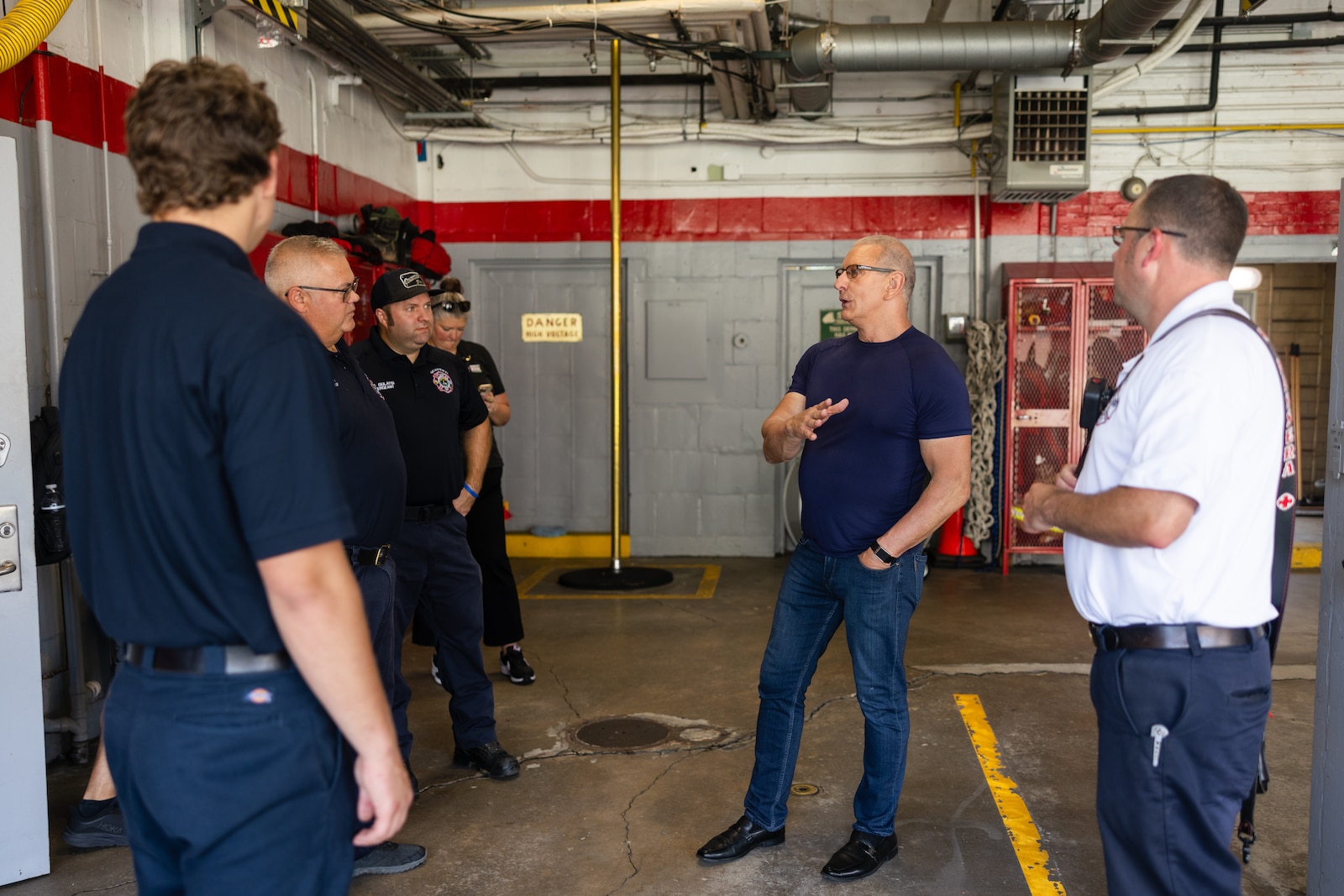 Celebrity chef and talk show host Robert Irvine speaks with volunteers with Marine Corps Base Quantico’s Fire and Emergency Services while visiting MCB Quantico, Virginia, July 11, 2025. Chef Irvine visited the base to show his support for military and civilian people who make up the Crossroads of the Marine Corps.