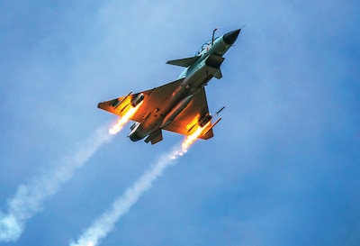 People’s Liberation Army Air Force J-10 fighter jet under Southern Theater Command fires rockets at simulated ground targets during live-fire
flight training exercise.