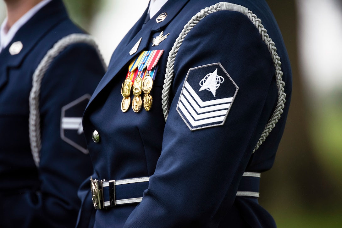 Close up shot of Space Force insignia on the sleeve of a guardian's dress uniform.