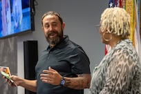 Jason Podzemny, U.S. Army Financial Management Command Military Pay Operations Support Division director, shares a moment with Wilhemenia Taylor, USAFMCOM MPO financial management analyst, during Taylor’s retirement ceremony at the Maj. Gen. Emmett J. Bean Federal Center in Indianapolis June 30, 2025. Taylor retired from USAFMCOM after more than 30 years of federal civil service and 15 years of military service. (U.S. Army photo by Mark R. W. Orders-Woempner)
