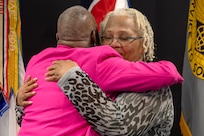 Kimberly Lawrence, U.S. Army Financial Management Command Military Pay Operations division director, shares a moment with Wilhemenia Taylor, USAFMCOM MPO financial management analyst, during Taylor’s retirement ceremony at the Maj. Gen. Emmett J. Bean Federal Center in Indianapolis June 30, 2025. Taylor retired from USAFMCOM after more than 30 years of federal civil service and 15 years of military service. (U.S. Army photo by Mark R. W. Orders-Woempner)