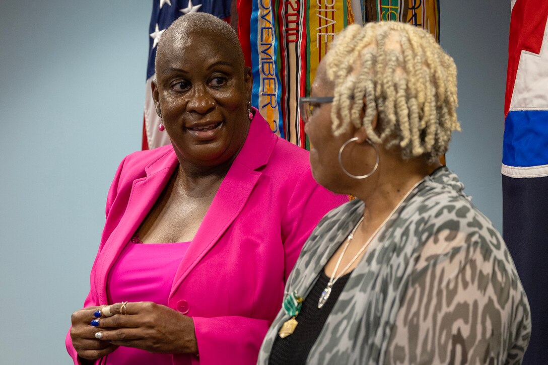 Kimberly Lawrence, U.S. Army Financial Management Command Military Pay Operations division director, shares a moment with Wilhemenia Taylor, USAFMCOM MPO financial management analyst, during Taylor’s retirement ceremony at the Maj. Gen. Emmett J. Bean Federal Center in Indianapolis June 30, 2025. Taylor retired from USAFMCOM after more than 30 years of federal civil service and 15 years of military service. (U.S. Army photo by Mark R. W. Orders-Woempner)