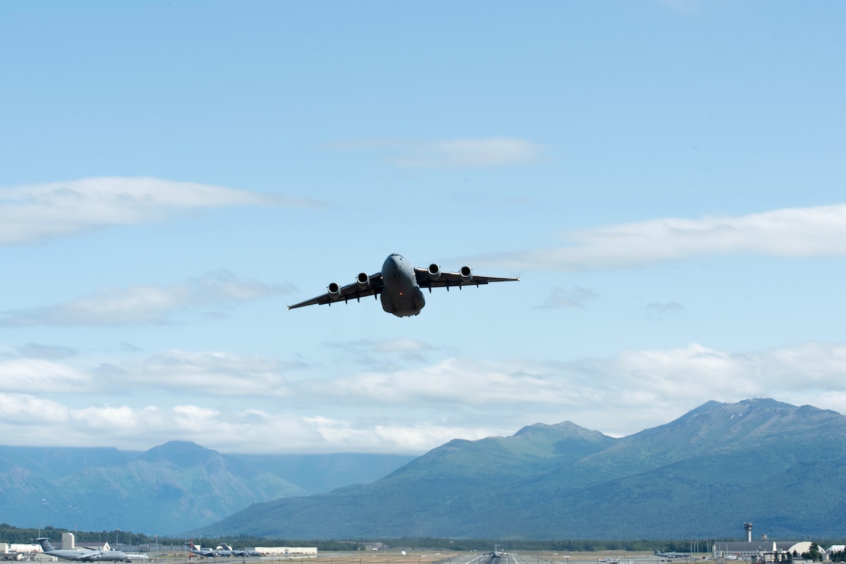 A Royal Australian Air Force C-17 Globemaster III departs from Joint Base Elmendorf-Richardson, Alaska, providing airlift support for 11th Airborne Division soldiers participating in Talisman Sabre 25, July 13, 2025.