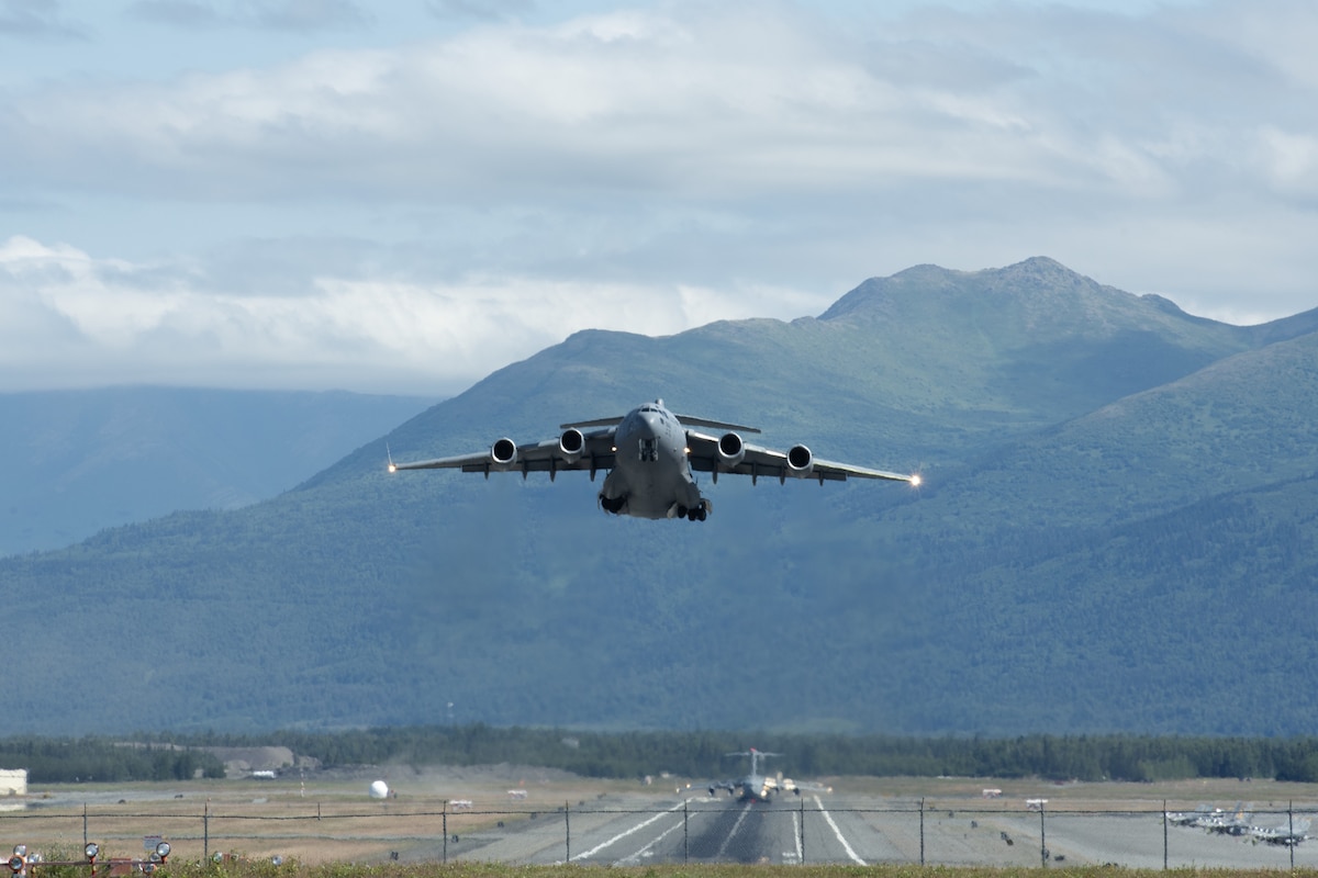 A U.S. Air Force C-17 Globemaster III assigned to the 437th Airlift Wing, Joint Base Charleston, South Carolina, departs from Joint Base Elmendorf-Richardson, Alaska providing airlift support for 11th Airborne Division soldiers participating in Talisman Sabre 25, July 13, 2025.