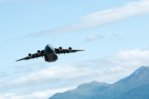 A U.S. Air Force C-17 Globemaster III assigned to the 437th Airlift Wing, Joint Base Charleston, South Carolina, departs from Joint Base Elmendorf-Richardson, Alaska, providing airlift support for 11th Airborne Division soldiers participating in Talisman Sabre 25, July 13, 2025.
