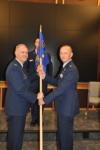 a person hands another a flag